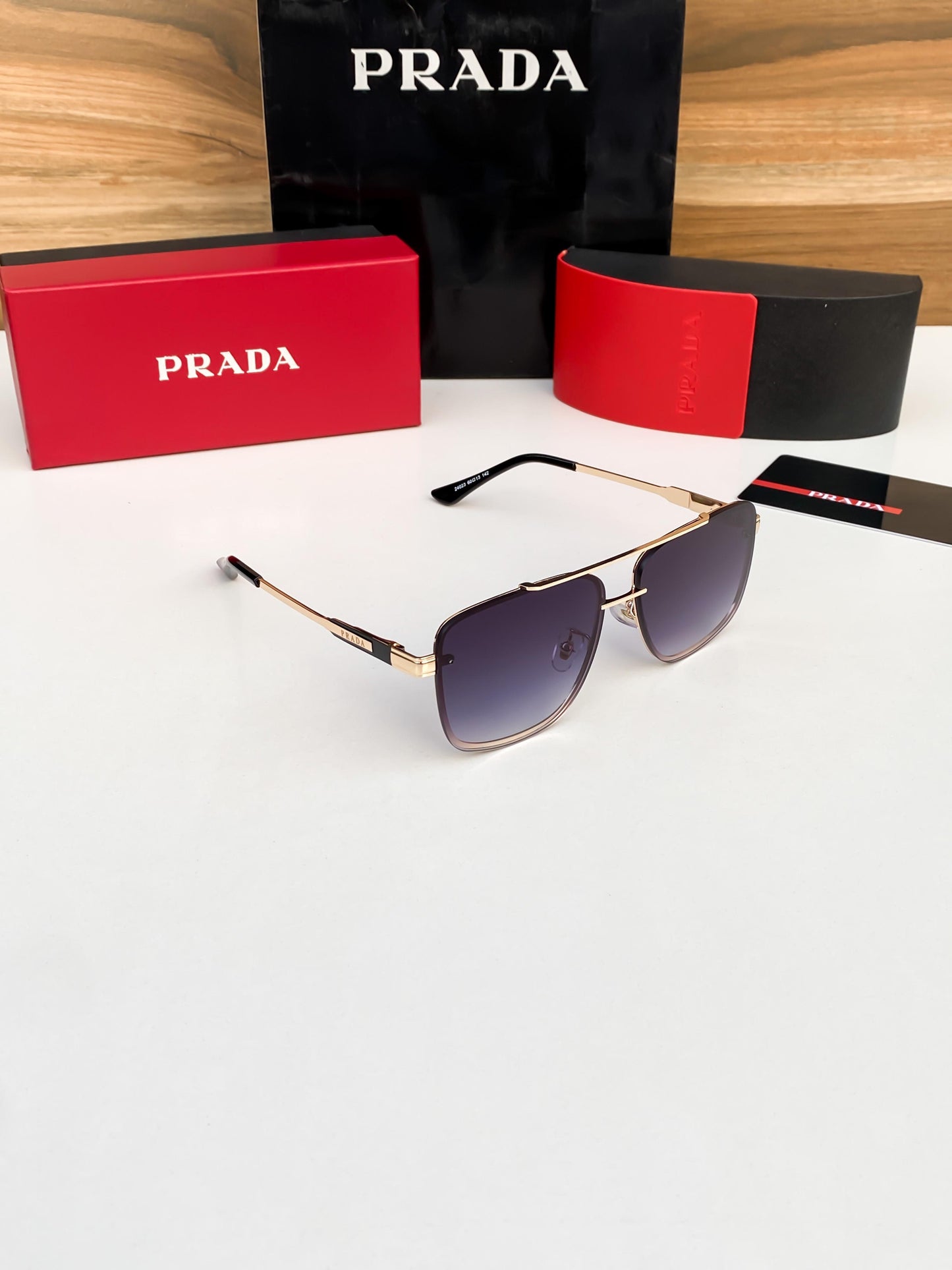 PRADA GOLD BLACK